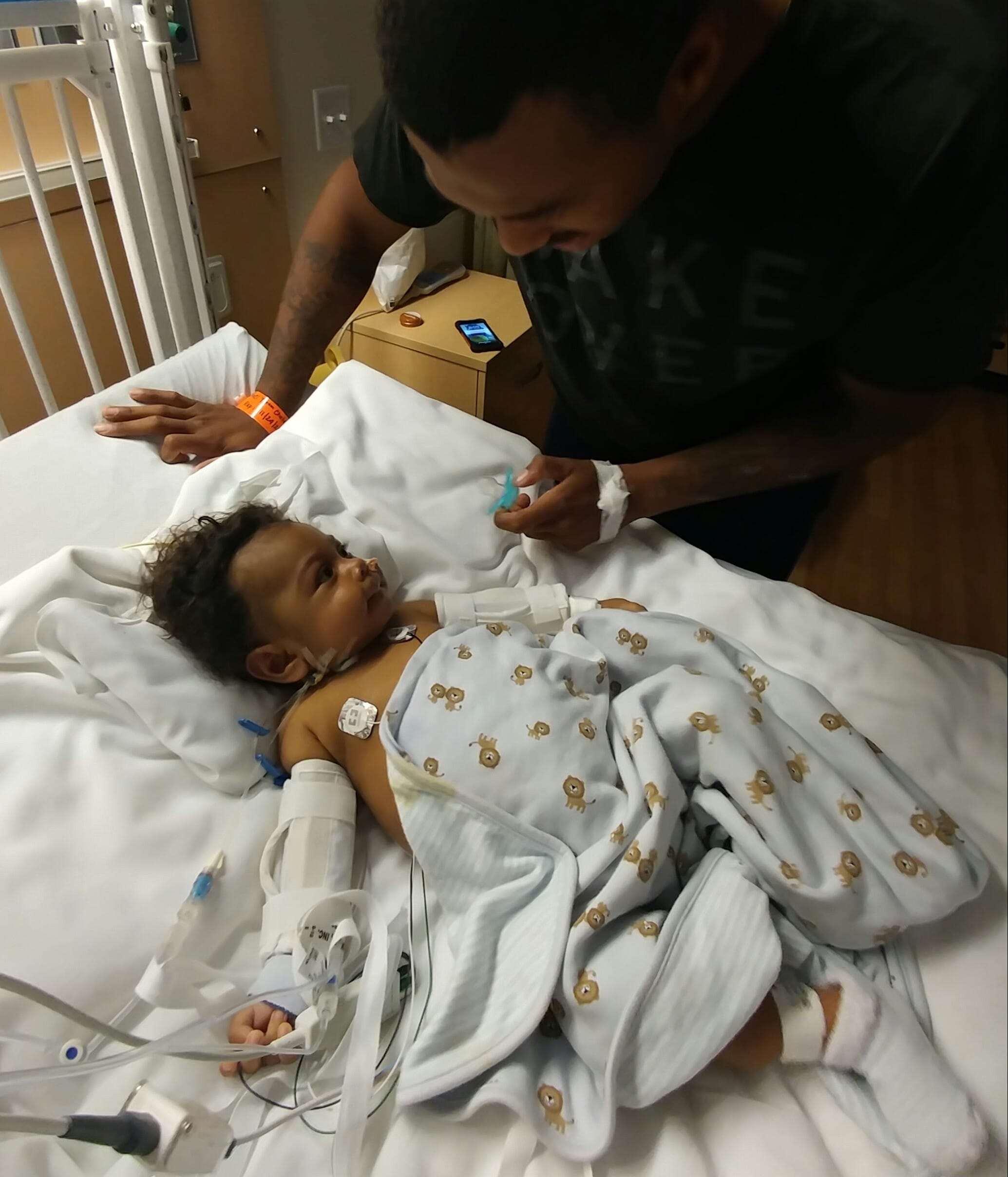 Dejon Daniels sees his son Donovan for the first time since the transplant.