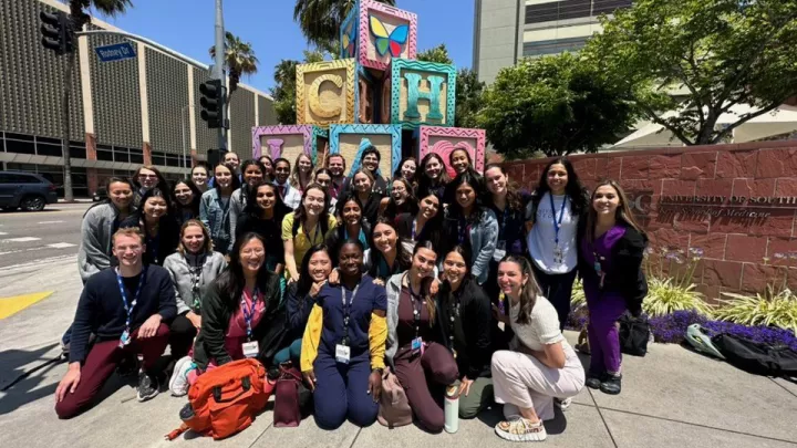 CHLA interns pose in front of Children's Hospital Los Angeles