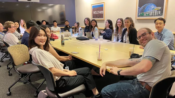 Members of Summer Oncology Research Fellowship at Children’s Hospital Los Angeles and USC pose for a group photo around a conference table