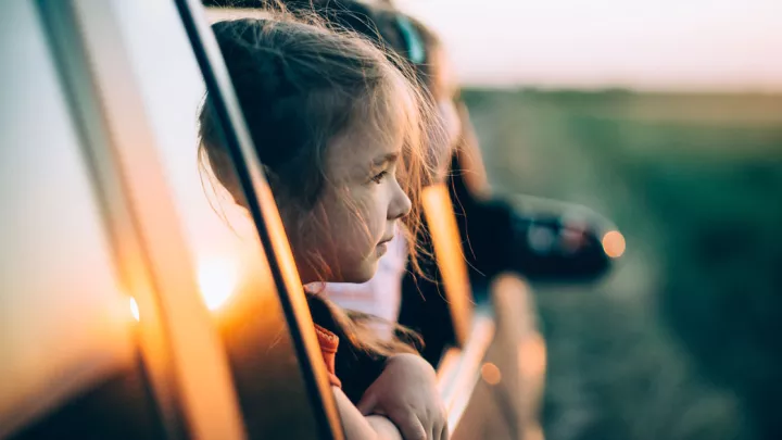 CHLA Blog - Motion Sickness - Girls looking out car window