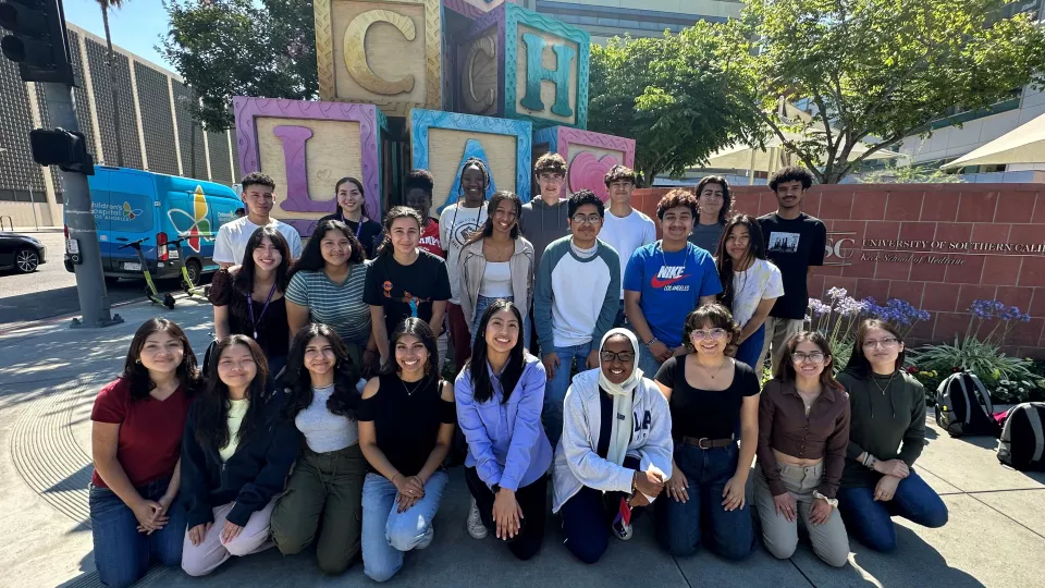 Members of LA-HIP Class of 2023-2024 pose for picture in front of CHLA blocks