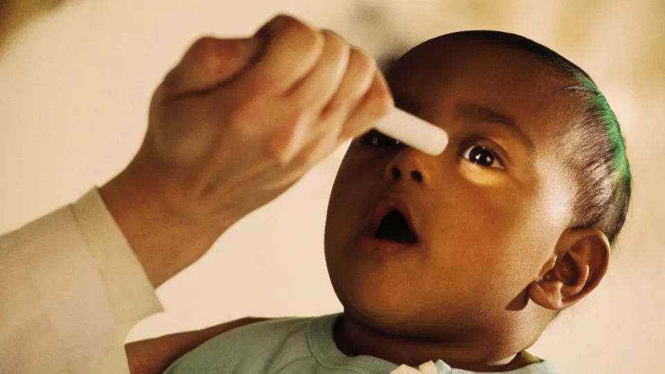 toddler boy brown skin eye exam