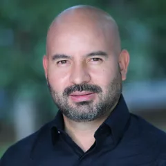 Professional headshot of Juan-Carlos Medina