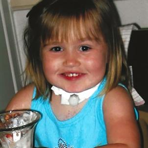 Lauren with her trach as a child