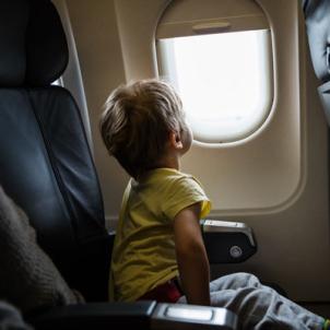 CHLA Blog - Motion Sickness - Boy looking out airplane window