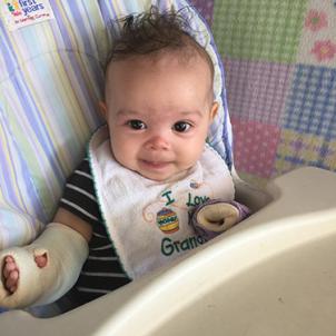 Forrest sits in his highchair