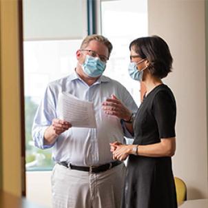 Dr. Judkins confers with
Jennifer Lee.