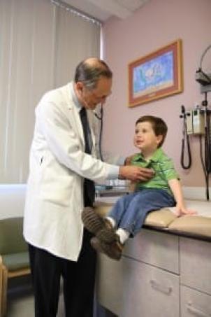 Dr. Robert Adler with child patient at Children's Hospital Los Angeles