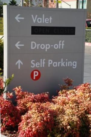 Sign that reads "Valet, Drop-off, Self Parking"
