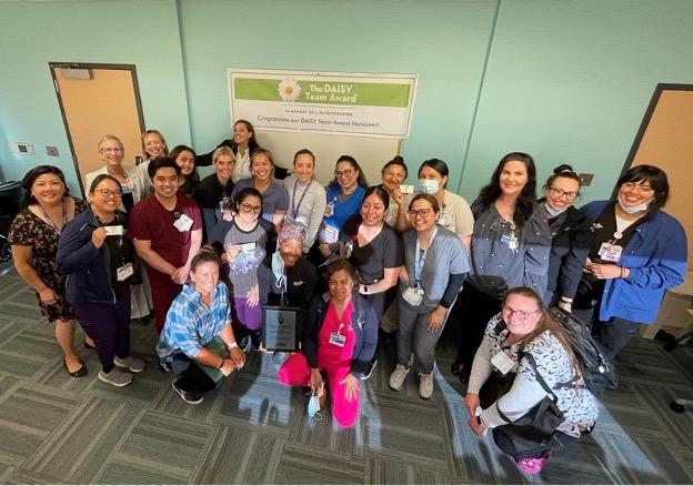 Members of CHLA's Monitoring and Screening Unit pose with their DAISY Team Award