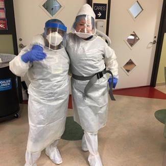 CHLA housekeeper Ana Gonzalez and colleague wearing PPE