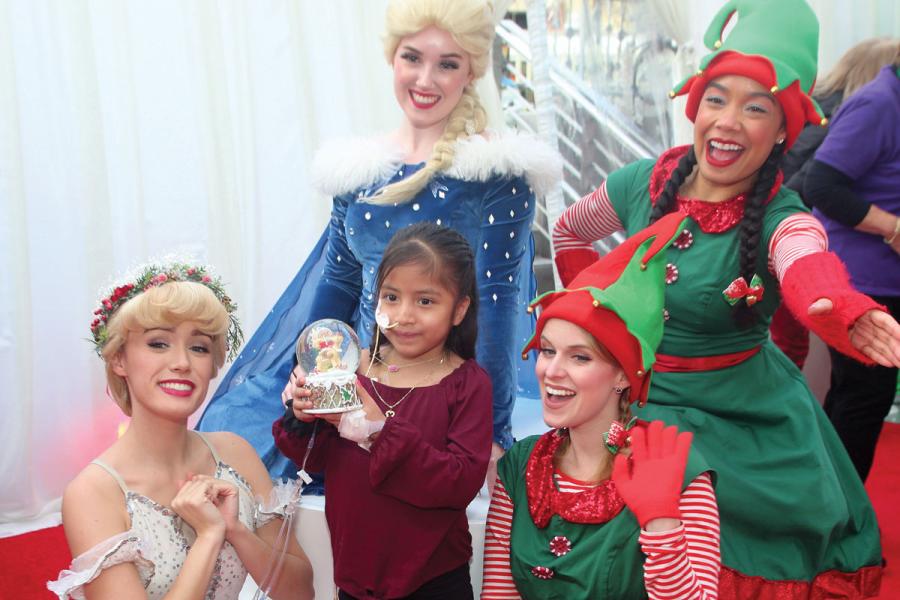 Winter wonderland characters with CHLA patient Kimberlyn