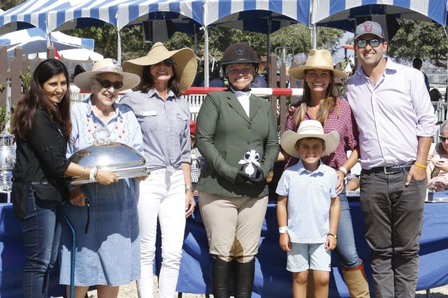 The Gabriel C. Duque, Jr. Memorial Trophy presentation at the Peninsula Committee’s 2019 Portuguese Bend National Horse Show. Left to right: Deepa Bhojwani, MD; Bonnie McClure, a member of the CHLA Foundation Board of Trustees and Chair of the Associates
