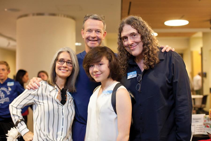 David L. Skaggs, MD, MMM, with (from left) Suzanne, Nina and Al Yankovic at the Holiday Family Volunteer Day