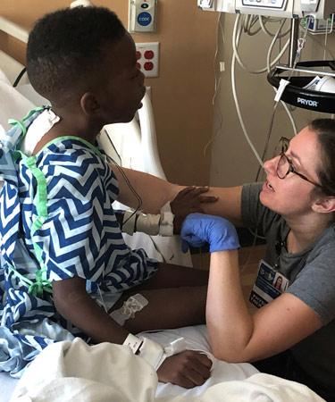 Cai with his physical therapist