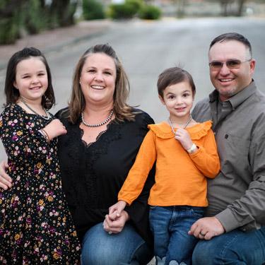 Emme and her family outdoors