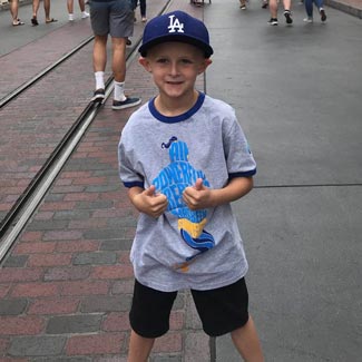 Josh at Disneyland giving two thumbs up
