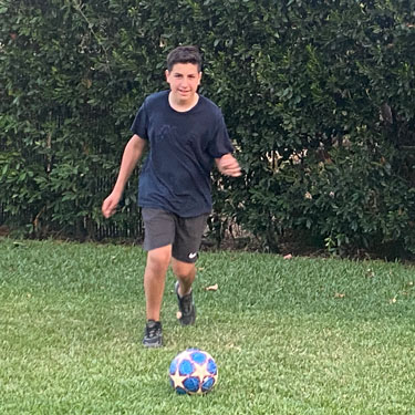Emmanuel playing soccer