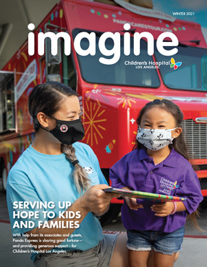 CHLA Imagine Magazine Winter 2021 Cover image showing female Panda Express employee with young female patient