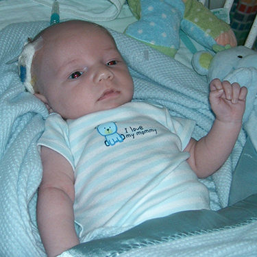 Baby Jaykob in his hospital crib