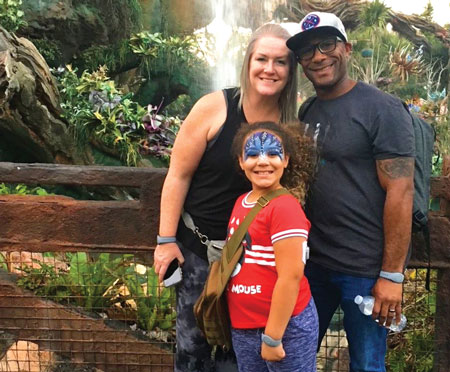 The Kenzie family in front of a waterfall